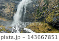 Fallbach mountain waterfall pouring over dark rock. Autumn in Austria. 143667851