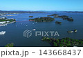 Aerial footage captures the beautiful scenery of Matsushima, one of Japan's three most scenic spots, including the islands floating in the bay, sightseeing boats, and the red bridge, showcasing Miyagi's famous tourist attractions. 143668437