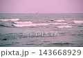 Ocean Waves at Dusk with Distant Fishing Boat in Toucheng, Taiwan 143668929