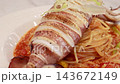 Grilled whole squid spaghetti pasta with tomato sauce on white plate. Grilled whole squid spaghetti pasta with tomato sauce on white plate. 143672149