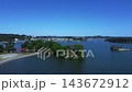 Aerial footage captures the beautiful scenery of Matsushima, one of Japan's three most scenic spots, including the islands floating in the bay, sightseeing boats, and the red bridge, showcasing Miyagi's famous tourist attractions. 143672912