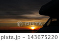Camper on seashore and sunrise over sea. Timelapse 143675220