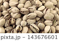 Pistachios in a wooden bowl. Wooden background. Healthy food. 143676601