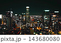 Illuminated downtown Los Angeles skyline at night with aerial views of city lights and skyscrapers 143680080