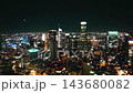 City skyline of Los Angeles illuminated at night from an aerial perspective showcasing downtown and its skyscrapers 143680082