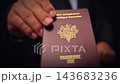 French Passport Held In Hand Close Up 143683236