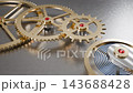 Macro loop video of a mechanical watch movement with gold gears and ruby jewel bearings in motion. 143688428