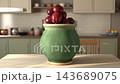 Fresh red apples inside a green ceramic pot on a kitchen table, rapidly transforming into eaten apple cores, during a smooth camera orbit 143689075