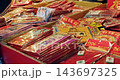 Taipei, Taiwan, February 4, 2026: Customers select colorful red envelopes on Dihua Street on the eve of the Lunar New Year. 143697325