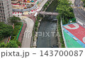 AUG 20 2026 Kai Tak River channel and urban skyline in Kowloon Hong Kong 143700087