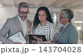 Business people, tablet and meeting in team discussion for project strategy or collaboration at the office. Group of employees in teamwork with technology for planning, proposal or ideas at workplace 143704028