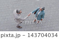 City, handshake top view and business people with welcome gesture for greeting, hello or introduction. Communication, shaking hands and senior executive partner with thank you, agreement or B2B deal 143704034