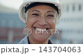 Portrait of woman in architecture with smile, helmet and job in project management at construction site. Safety, engineer and happy face of female contractor with confidence in building maintenance. 143704063