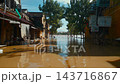 flooded city or town with buildings submerged in overflow water and mud, village underwater after heavy tropical rain and typhoon, consequences with dirt on the street 4k 143716867