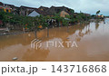 flooded city or town with buildings submerged in overflow water and mud, village underwater after heavy tropical rain and typhoon, consequences with dirt on the street 4k 143716868
