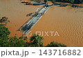 flooded city or town with buildings submerged in water, underwater village after heavy tropical rain and typhoon, An Hoi lantern bridge in Vietnam, climate change and global warming impact 4k 143716882