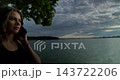 Contemplative and Reflective Moments by the Tranquil Lakeside at the Beautiful Dusk Hour 143722206
