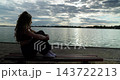 A Contemplative Moment by the Waters Edge, embracing beauty and tranquility in nature 143722213