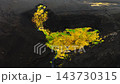Black volcanic mountain with golden moss ribbon under cloudy sky from aerial viewpoint, dramatic highland landscape scene for nature and travel visuals 143730315