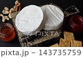 Brie or Camembert cheese is a white, round shape for baking and melting. Camembert cheese 143735759