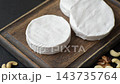 Brie or Camembert cheese is a white, round shape for baking and melting. Camembert cheese 143735764