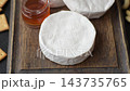 Brie or Camembert cheese is a white, round shape for baking and melting. Camembert cheese 143735765