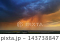 Dramatic storm clouds over expansive farmland at sunset 143738847