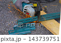 Worker cutting metal with many sharp sparks using equipments to cut iron 143739751