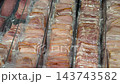 Rows of sliced deli meat sealed in clear plastic packages, arranged in refrigerated display trays for grocery shopping, food retail, packaging, storage, and supermarket merchandising video video Rows of sliced deli meat sealed in clear plastic packages, arranged in refrigerated display trays for grocery shopping, food retail, packaging, storage, and supermarket merchandising video video 143743582