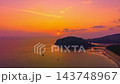 Time lapse Waves kiss the sandy beach while the fading sunlight creates a warm, romantic glow over the horizon. Serene Paradise Sunset by the Sea at Kala island Layan beach Phuket Time lapse Waves kiss the sandy beach while the fading sunlight creates a warm, romantic glow over the horizon. Serene Paradise Sunset by the Sea at Kala island Layan beach Phuket 143748967