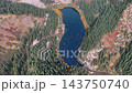 Aerial photograph taken from high above, capturing the long, narrow basin of Lake Kaindy and the submerged forest. 143750740
