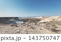 A landscape captured while traveling through the pale-colored layered cliffs and eroded valleys of Mangystau. 143750747