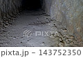 Smooth camera movement inside a dark cave tunnel revealing a hidden hoard of ancient patinated coins inside a broken pipe. 143752350
