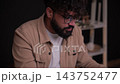 Focused male entrepreneur writing notes in his agenda 143752477