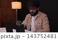 Focused young professional man working on laptop computer at night 143752481