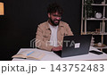 Young businessman chatting and working on laptop 143752483
