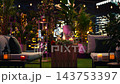 Romantic date table arrangement at luxury lifestyle restaurant on rooftop terrace. Wine glasses, red rose and candles decorating elegant outdoor lounge 143753397