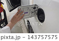 A woman refueling at a self-service gas station: From opening and closing the cap to completing the refueling process. A woman refueling at a self-service gas station: From opening and closing the cap to completing the refueling process. 143757575
