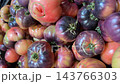 Heirloom tomatoes fill vertical frame with purple, red, pink, and orange colors, showcasing organic produce texture and natural variation for farmers market, food, culinary, and grocery content video Heirloom tomatoes fill vertical frame with purple, red, pink, and orange colors, showcasing organic produce texture and natural variation for farmers market, food, culinary, and grocery content video 143766303