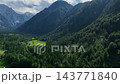 landscape with mountains stunning summer scenery with alpine meadows and mountains in slovenia logarska dolina and alpine forest with green fields from solcava panoramic road 143771840