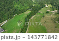 Robanov kot valley in the Slovenian alps. in European Alps. Panoramic aerial shot over vast rolling green hills and dense forests in Slovenia. 143771842