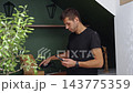 Man preparing LED strip before installation at home 143775359