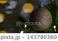 Christmas spruce tree decorated with balls. New Year celebration. Closeup 143780360