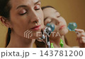 Women enjoying a relaxing beauty treatment at a wellness center 143781200