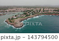 Mallorca Shoreline Appears From Above With Rocky Point, Harbor Inlet And Sprawling Coastal Settlement. 143794500