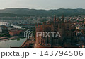 Aerial View Moves Across Palma Cathedral And Marina In Mallorca. Gothic Architecture Anchors Cityscape, With Boats, Waterfront Buildings, And Mountain Ridges In Evening Light. 143794506