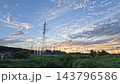 A time-lapse of a sunset, a landscape with a transmission tower. 143796586