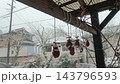 On a cold, snowy day, the persimmons drying under the eaves are ready to eat. 143796593