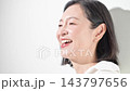 [White background] A Japanese woman in her 50s with a bright smile and cheerful expression in a video about beauty, naturalness, happiness, and a positive outlook. 143797656