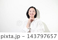 [White background] A Japanese woman in her 50s with a bright smile, showing her beauty, naturalness, happiness, joy, positive outlook, and worries. 143797657